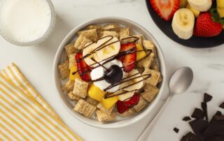 Banana Split made with Shredded Wheat in a bowl.